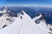 On the immaculate snow ridge that leads to the summit of Mont Blanc de Courmayeur