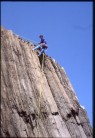 Malcolm Clark abseiling off after the first ascent of 'Polly's Peril' in 1992.