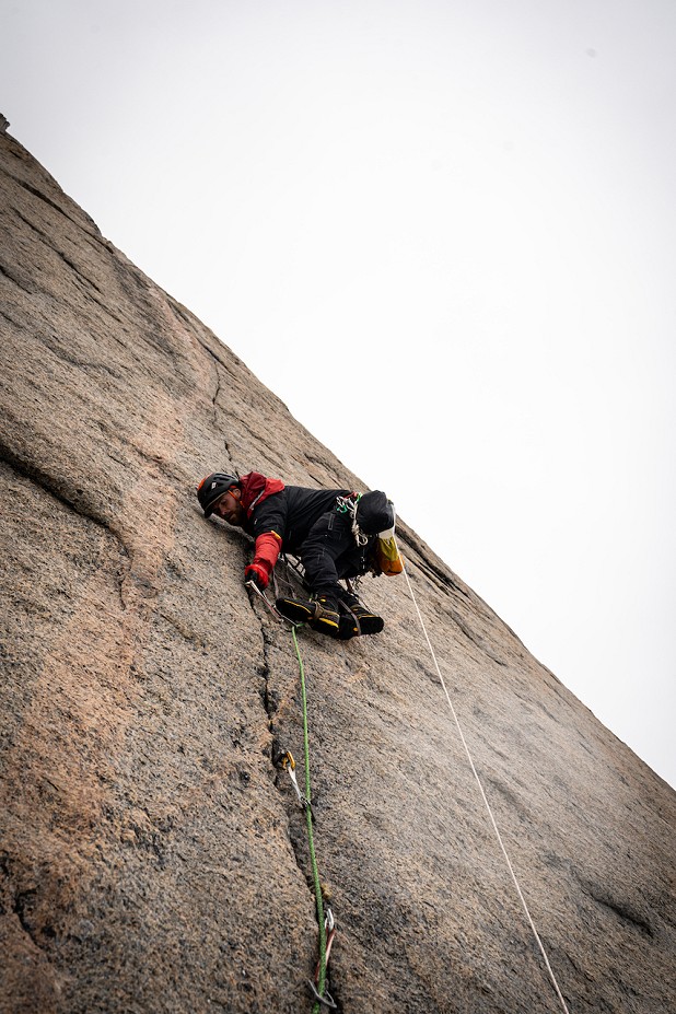 Aiding a delicate crack pitch.  © Leo Houlding