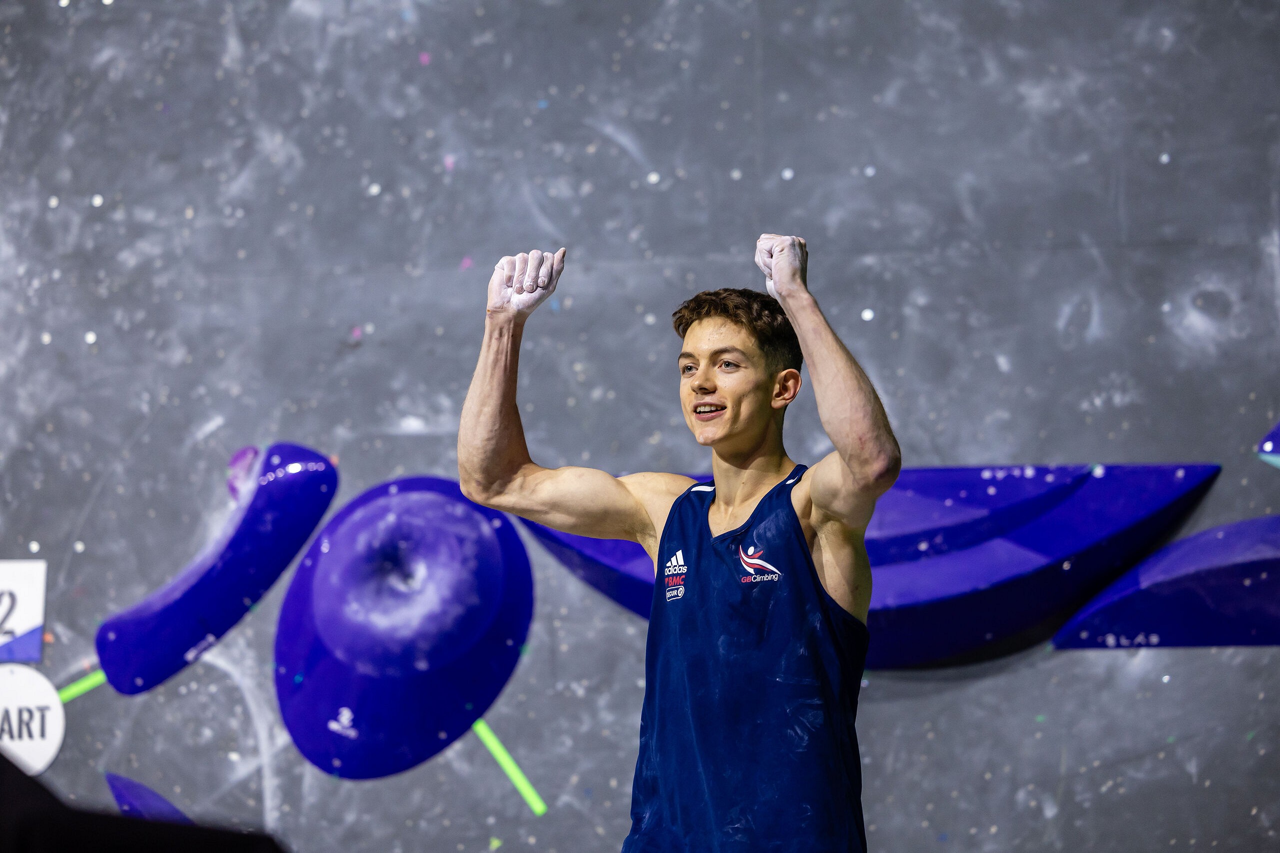 Toby Roberts celebrates a Top in the Boulder round.  © Jan Virt/IFSC
