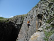 Bill Turner throwing a few shapes on third ascent of Chisel Beach