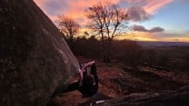 Enjoying a gorgeous sunset on the worst problem at stanage