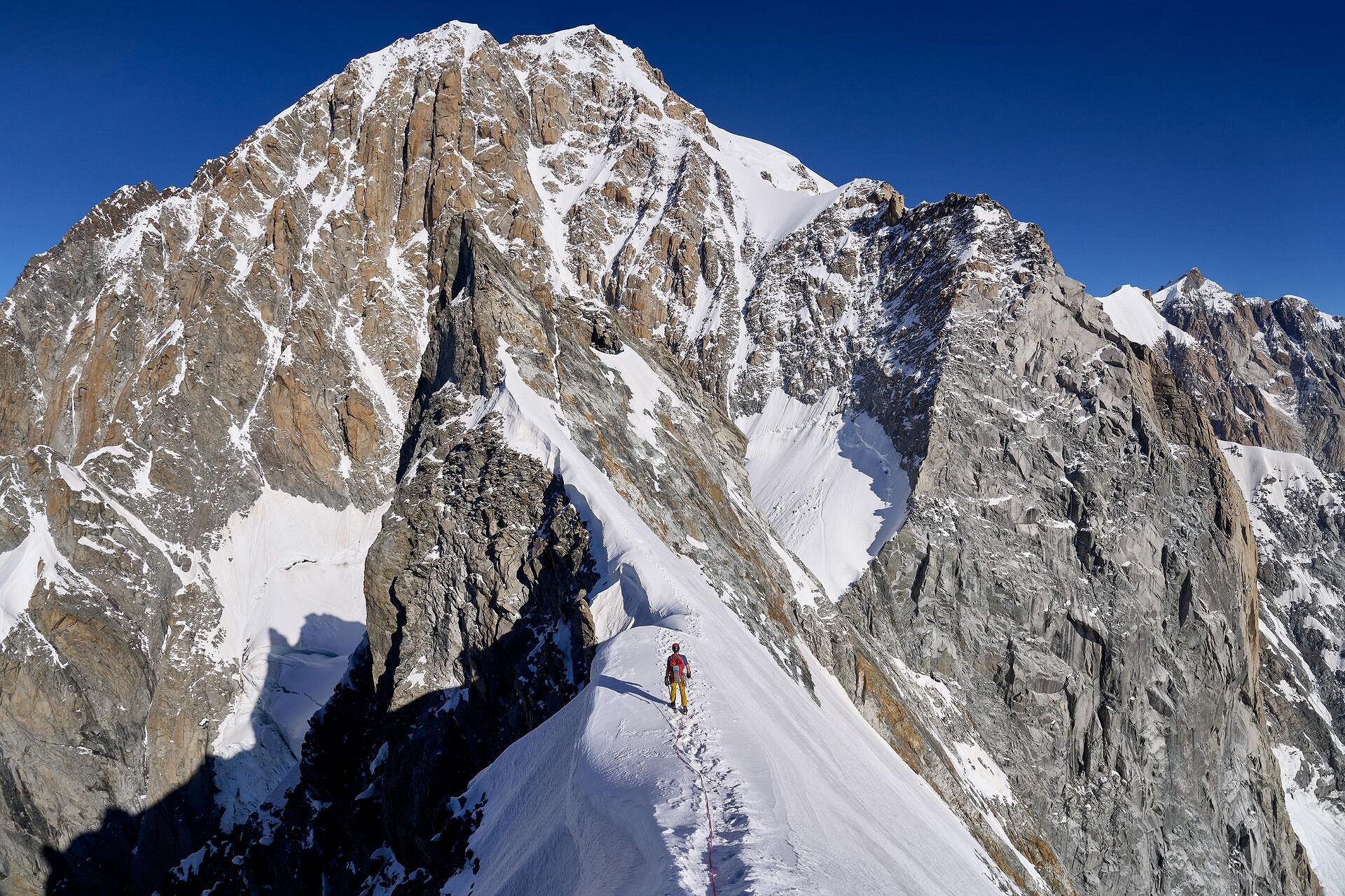 Crossing the Aiguille Blanche de Peuterey with the wild south side of Mont Blanc in front of us  © Hamish Frost