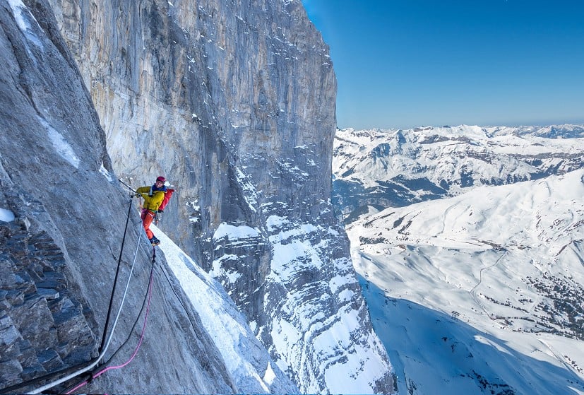 Paul Swail on the fixed ropes of the Hinterstoisser Traverse.  © Luke Davies