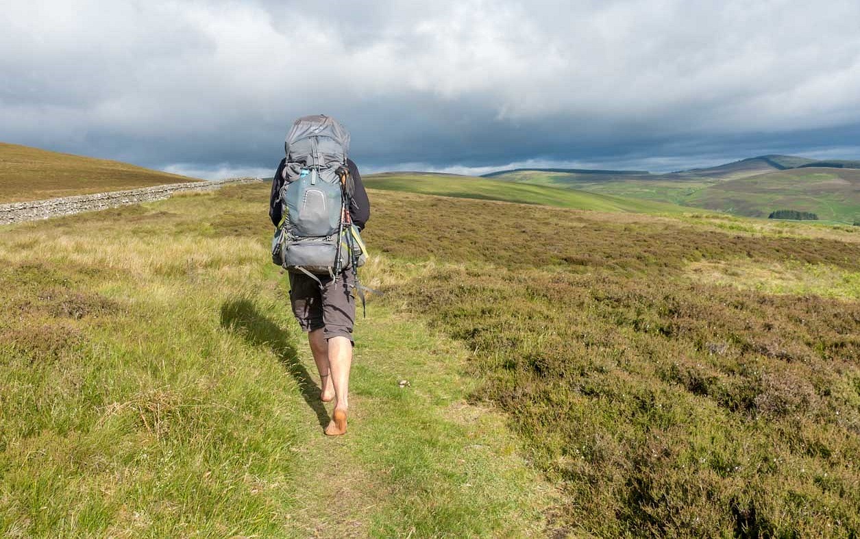 Warm weather, soft dry grass - why not go the full monty?  © Barefoot Backpacker