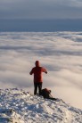 A hiker enjoying the endless stretch of cloud at the summit of Blencathra.