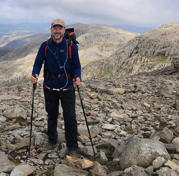 He detoured to climb the highest hills in each nation - as here on Scafell Pike  © Patrick Davies