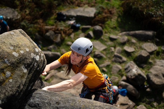 Reaching for the next hold on Birchen Edge.  © Ruby Chapman