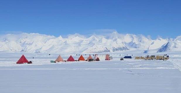 A larger field camp near the Beamish Mountains. The Pyramid tents are used for sleeping and eating and the large Weather haven   © BAS