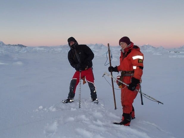 Field Guides Julie Baum and Mark Scales drilling and measuring sea ice around Rothera Point  © Tom Sylvester
