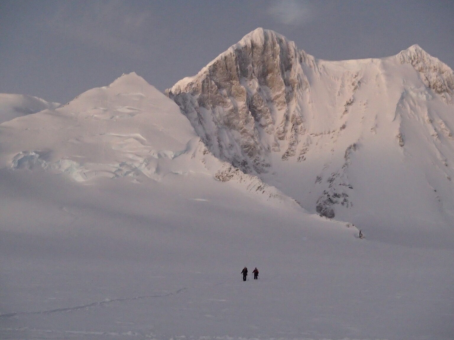 A party returning to camp after climbing Myth (the smaller peak on the left)  © Tom Sylvester