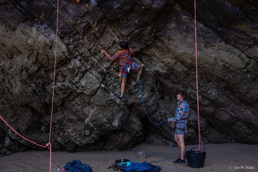 Zoe starting Marine Layer (Fr7A+) down in Rhossili beach at the Gower Climbing Festival '23.  © JacobIsaac772