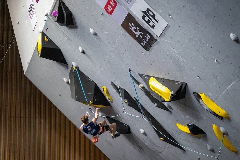Toby Roberts works his way through the lower crux section.  © IFSC
