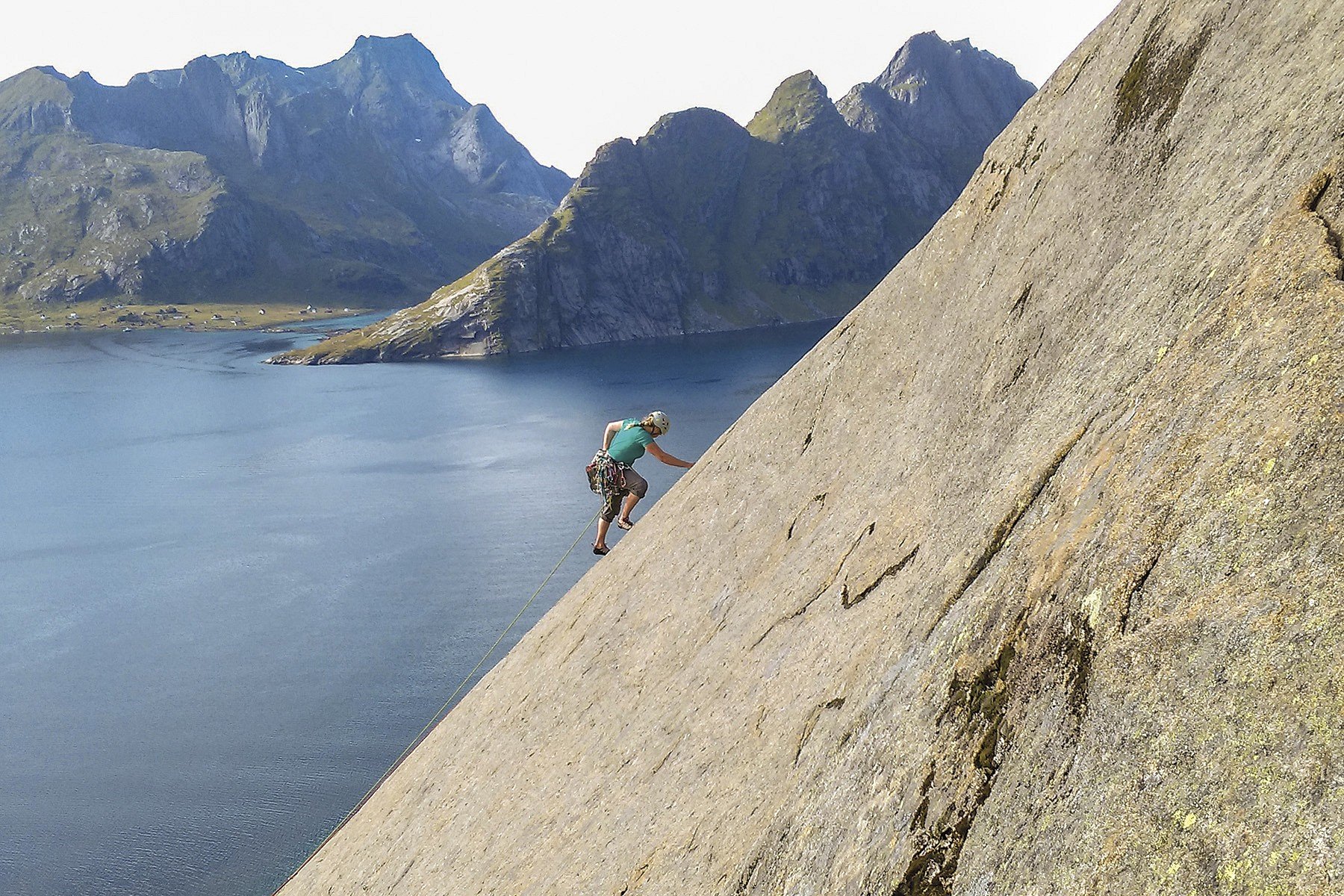 Maia Hunnex climbing second pitch of Sørvest pillar (N6-) on Olstinden.   © Trevor Wilson