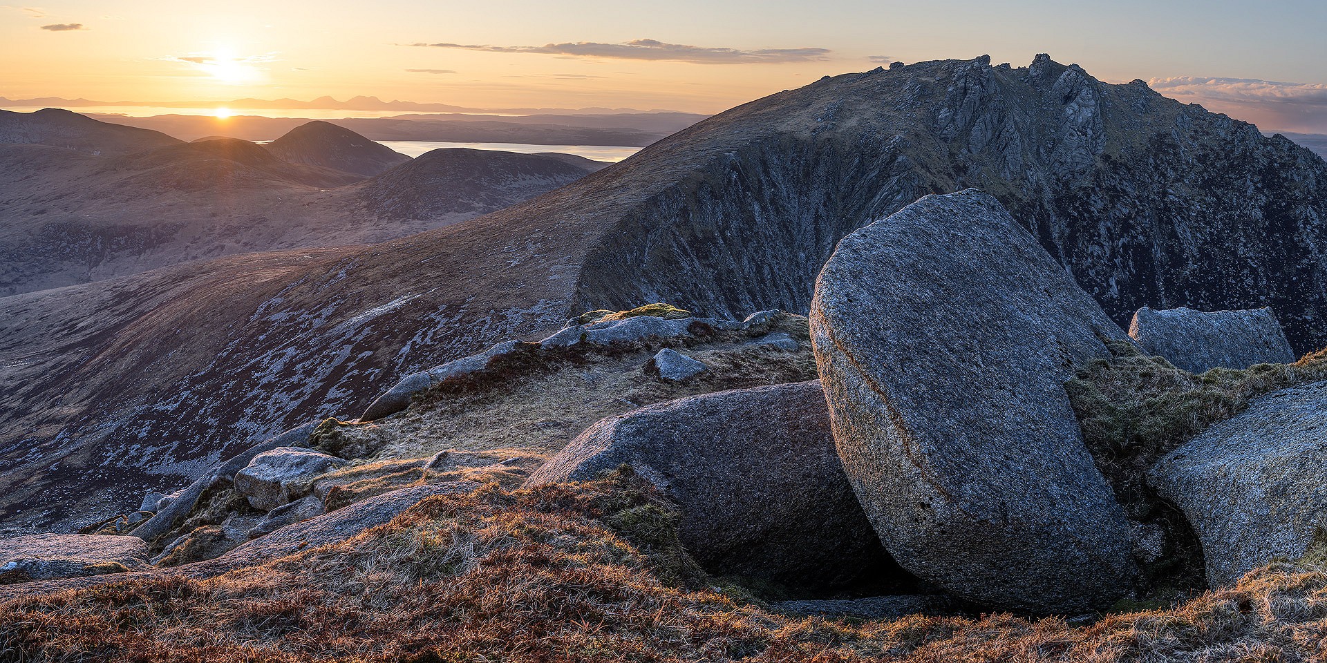 Casteal Abhail from Cir Mhor with the sun setting over the Paps of Jura  © Brian Pollock