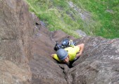 Pippa aiming for a much needed good hold on the sustained Grey Panther (E1 5b), Kilt Rock, Isle of Skye, Scotland<br>© Jamie Moss