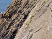 Kinky Boots, Baggy Point, Moving across the traverse to first belay