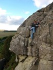Reaching to remove gear in rather high winds  on Flies (S 4b) at Rothley Crag
