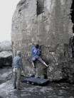 John on a highball problem at Doolin bouldering crag, Co. Clare, Ireland