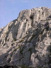 Climber topping out on Direct Route, Glyder Fawr