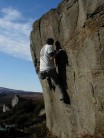 Paul Willis on the boulder problem Rock On (5c), Slipstones, Yorkshire