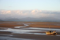 Sun setting over Duddon Estuary with Scafell and The Old Man of Coniston in the background