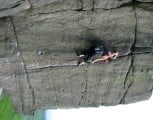 Thea Williams wrestles with The Asp (E3 6a) at Stanage