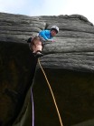 Stepping out into exposure on Robin Hood's Right Hand Buttress Direct HS4a (Stanage Popular)