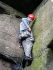 Rob selecting gear under the roof of Horatio's Horror, Birchen Edge