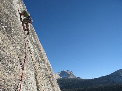 Leaving belay on third pitch of West Crack. Cathedral Peak in the background.  © Jon e H