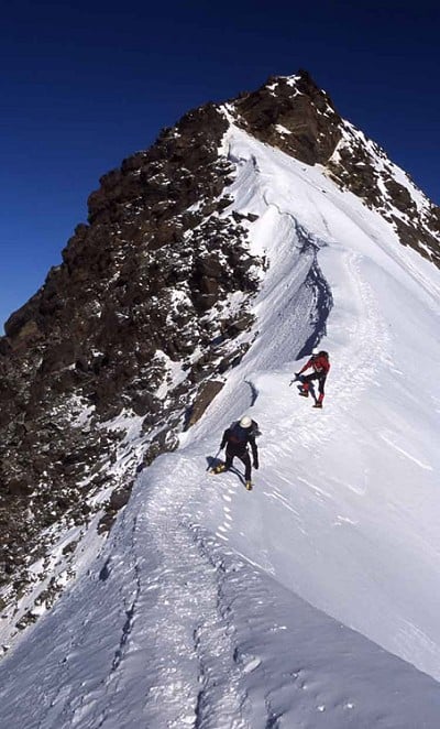 Summit ridge, Weissmies, in a gale  © Dom Connaway
