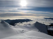 View off the summit of Illimani 6462m with clouds over the Amazon basin