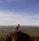 Mike sitting on top of the world