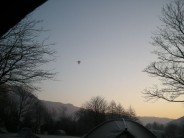 Hot air balloon over Great Langdale campsite on a frosty february morning.