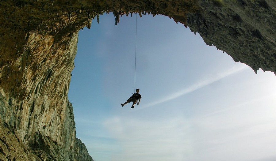 Gilles Mauléon lowering off DNA in the Grande Grotta on Kalymnos  © Alan James - Rockfax
