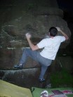 Michael Harrison at Dusk, squeezing over the lip of "An Uncoloured-in Problem Direct, B6", Houndkirk Tor, Peak Distri