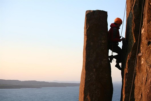 Louise showing her mastery of the chimney on Girona, Fairhead  © Andy Simpson