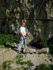 Daniel strapped to a rock and belaying at Winspit Quarry